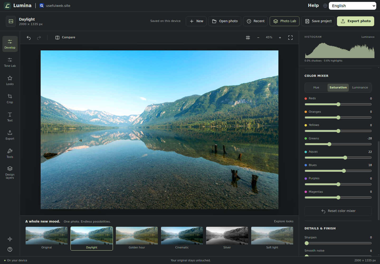 Lumina editing an alpine lake photo, with a live histogram, light and color controls, and a strip of creative looks